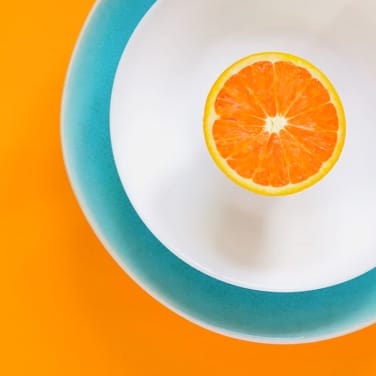 an orange on a plate